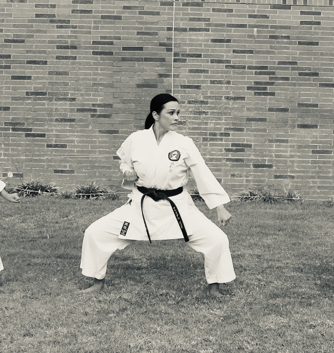 Senpai Crystal Villagran, 4th Dan Black Belt, women's self-defense and traditional kata instruction specialist.