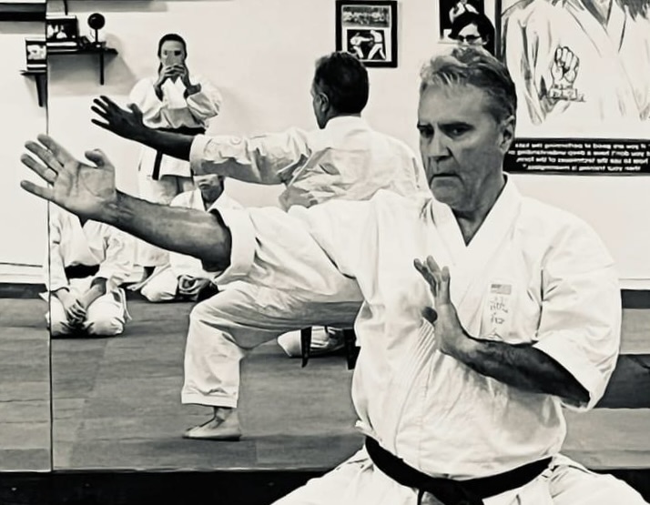 Sensei Edison Valente, 6th Dan Black Belt, self-defense teacher incorporating traditional weapons and martial arts forms.